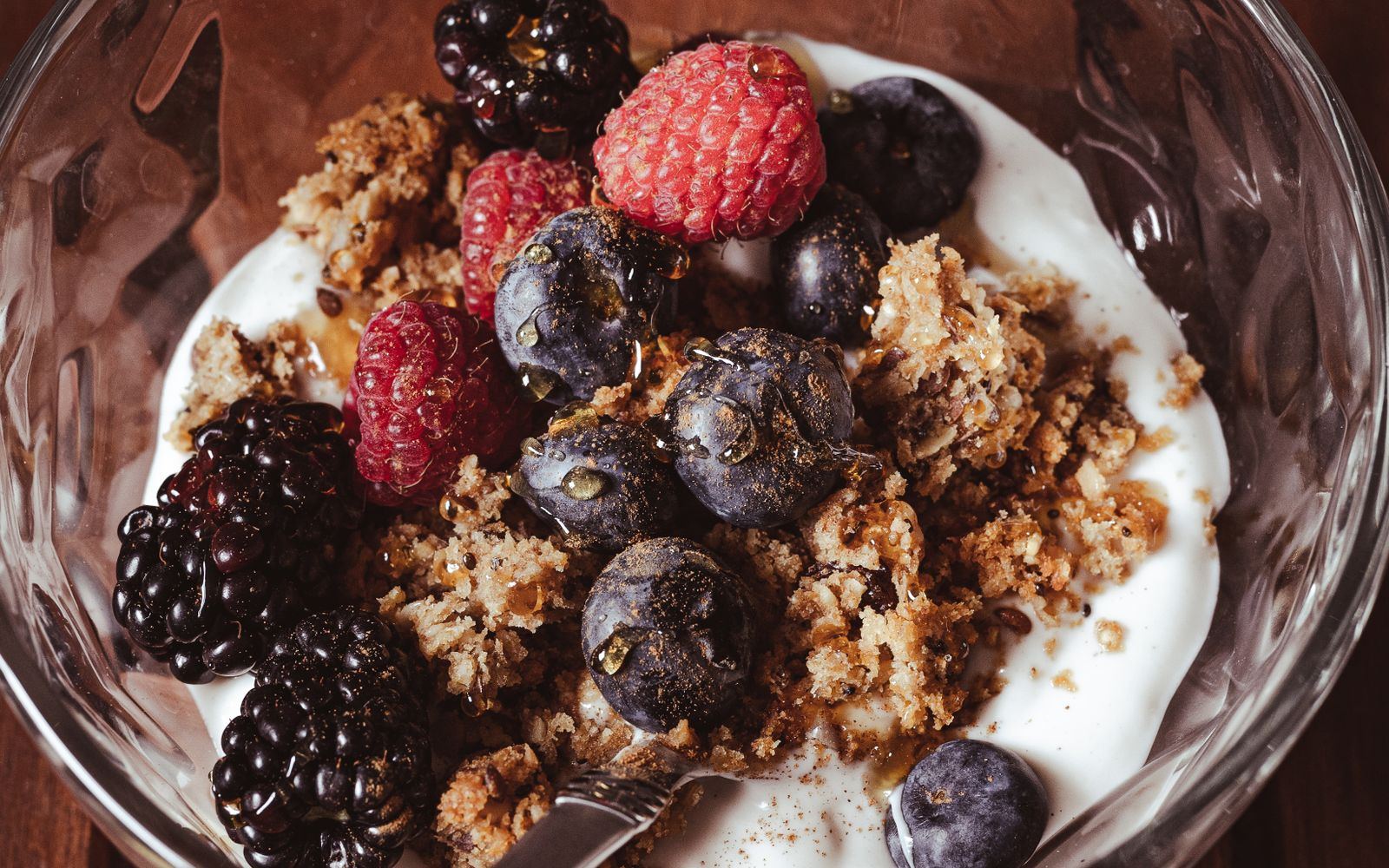 A bowl of yogurt topped with berries